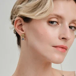 Asymetryczne, złote kolczyki kwiatki z kryształem z kolekcji Bery