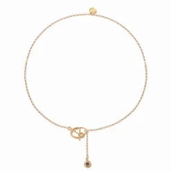 Delikatny, pozłacany naszyjnik z niebieskim kryształem z kolekcji Holos