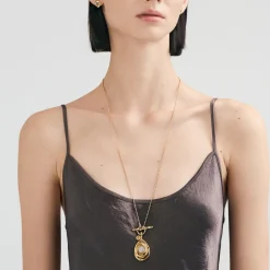 Długi, pozłacany naszyjnik z meteorytem z kolekcji Meteoros