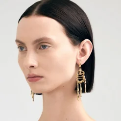 Długie, pozłacane kolczyki na biglu z meteorytem z kolekcji Meteoros