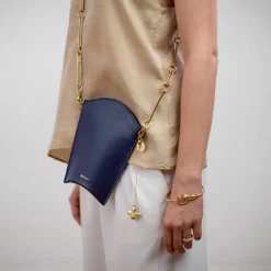 Złota zawieszka do torebki z koniczynką